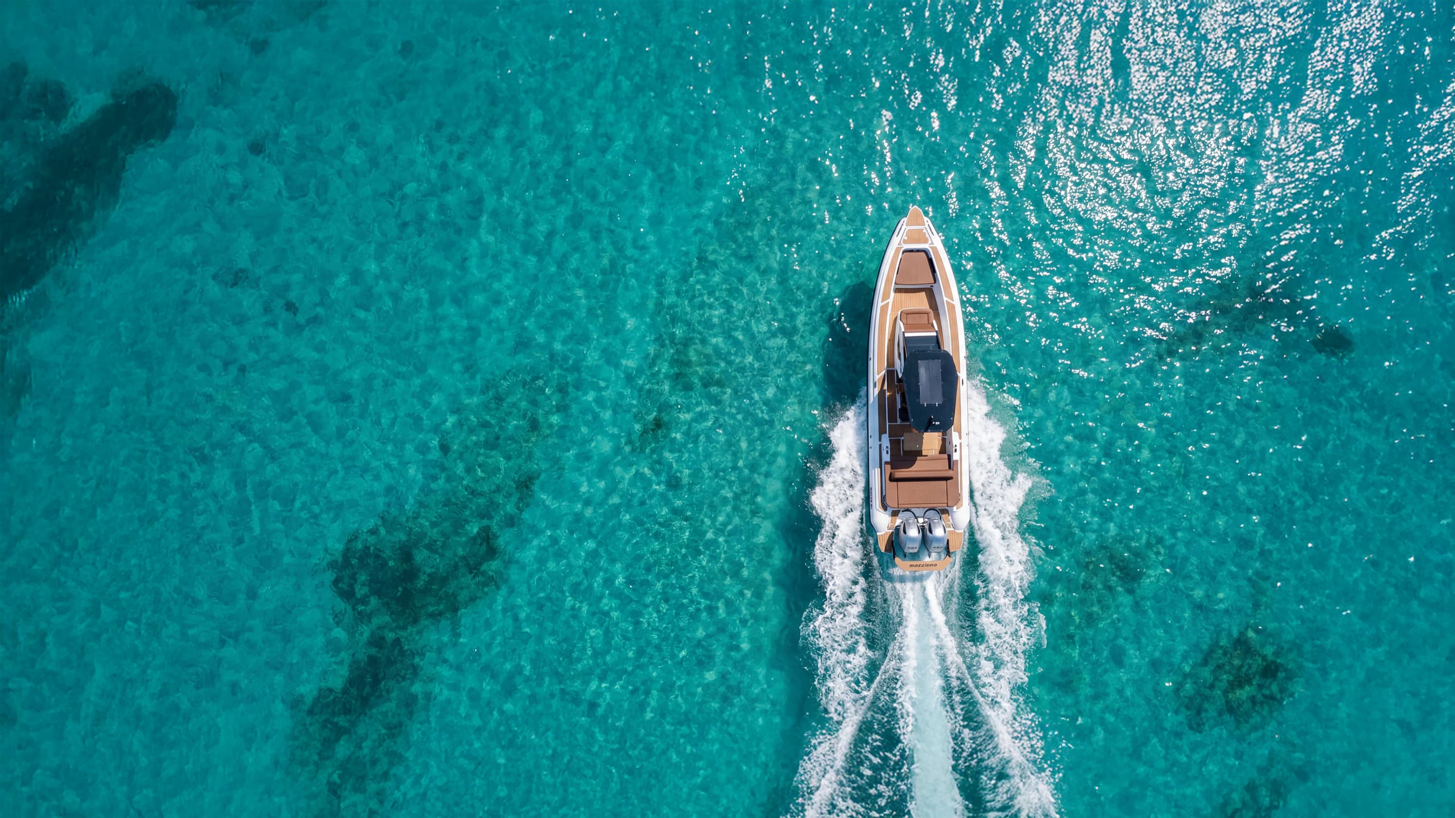 RIB cruising the golden-hour turquoise water near Lefkada